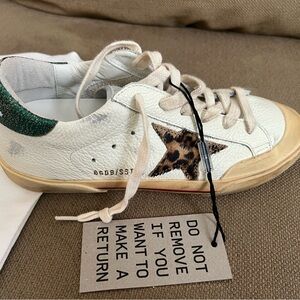 New Golden Goose sneakers. White with animal print star and green on the back
